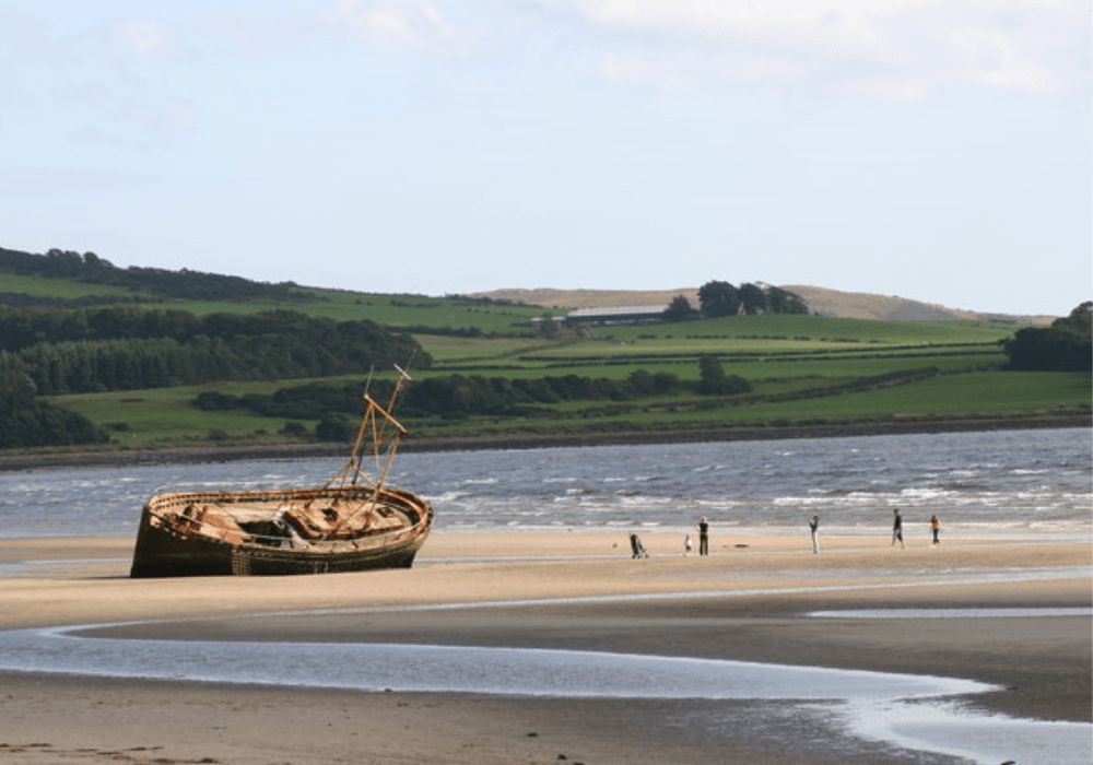 Shop wreck on Ettrick Bay Beach, overlooking Kyles and Bute